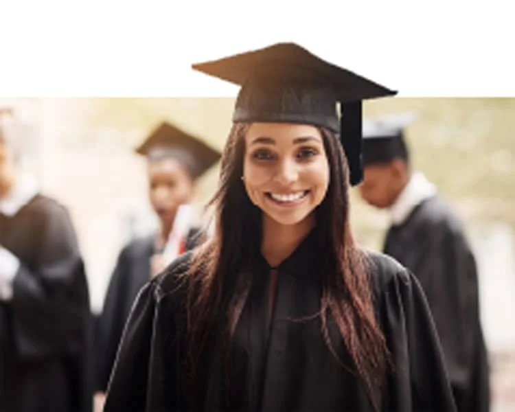 A graduating girl in a cap and gown